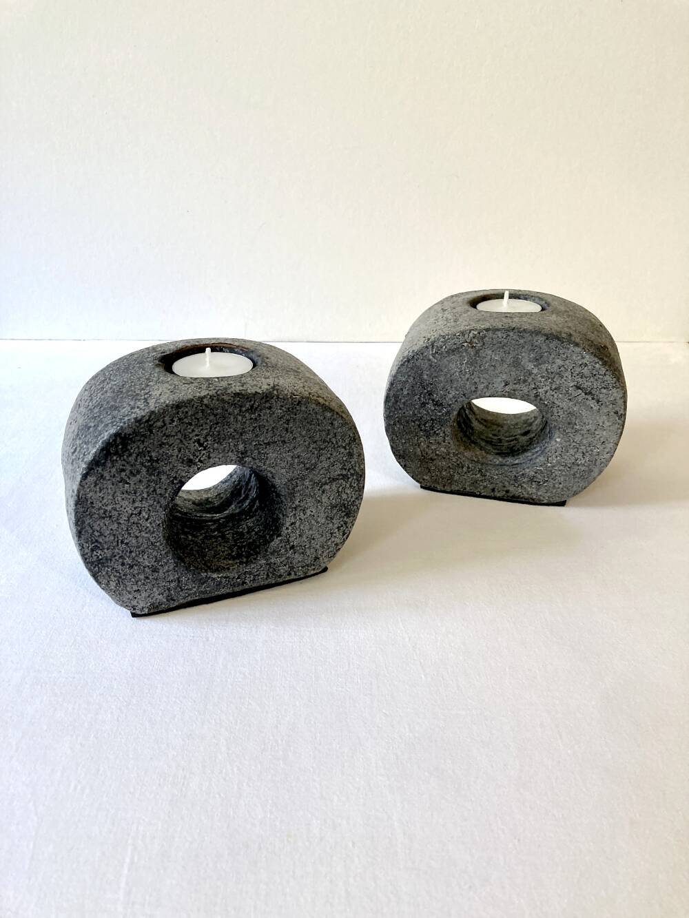 Pair of terracotta candle holders with anthracite finish, 1980s.
