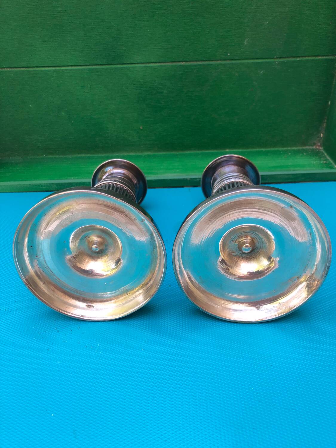 Pair of Louis XVI style candlesticks in silvered bronze