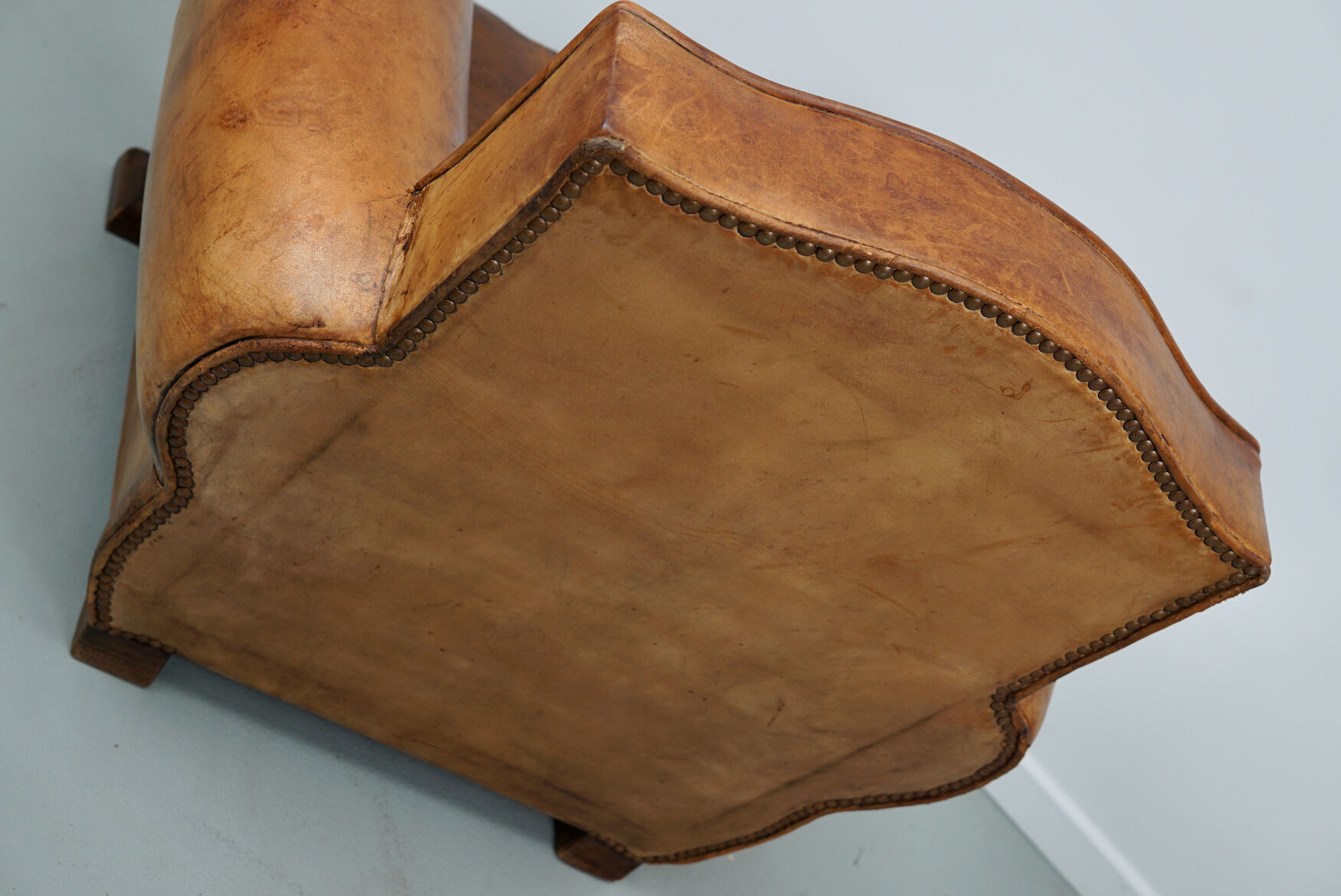French moustache back cognac-colored leather club chair, 1940s