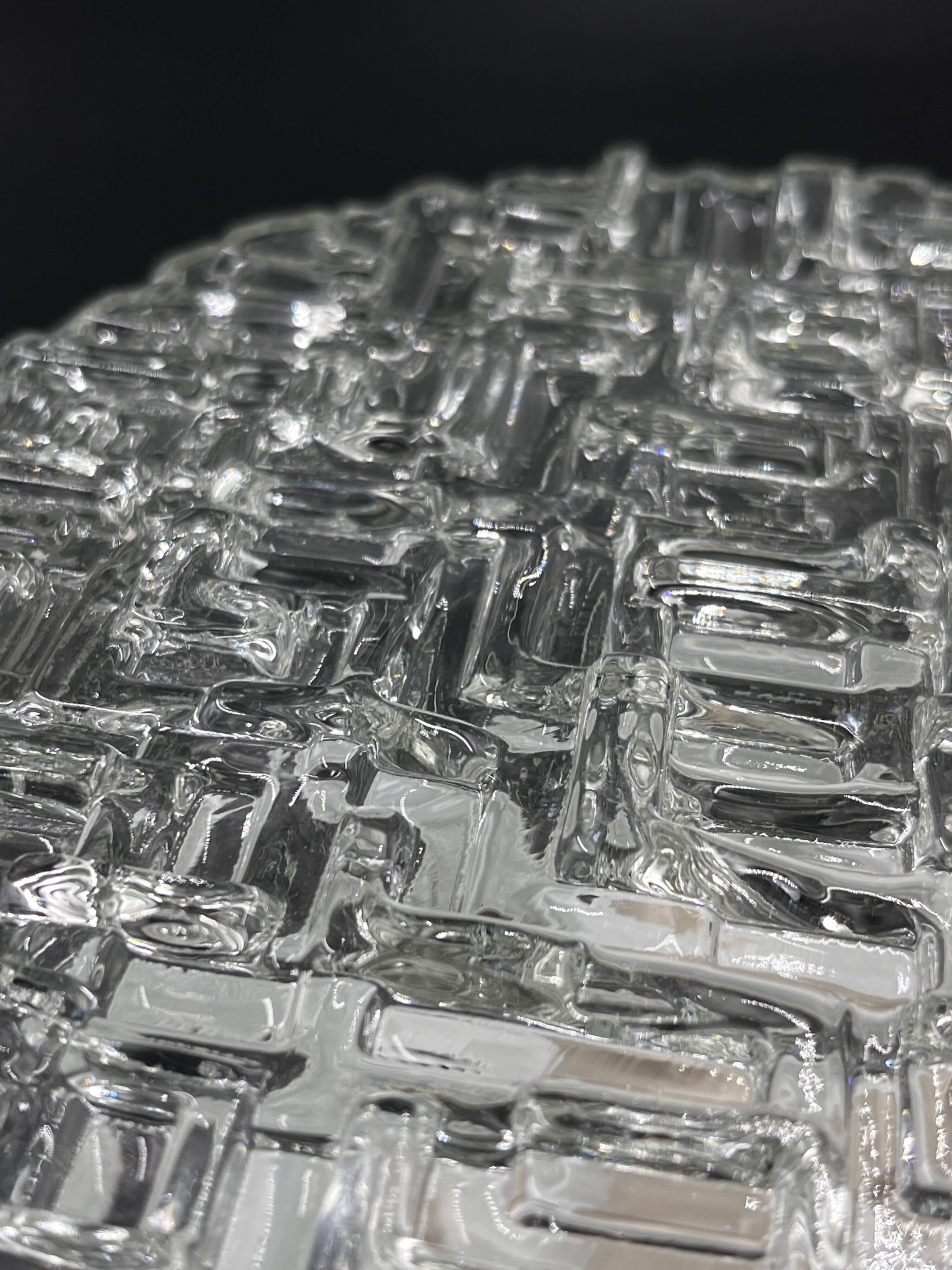Molded glass ceiling light with relief