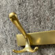 Vintage coat rack in gilded aluminum