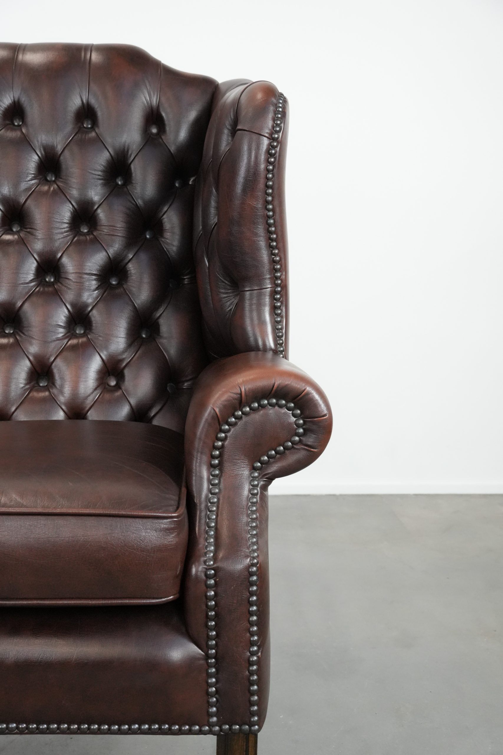 Brown cowhide leather Chesterfield wingback armchair in English style