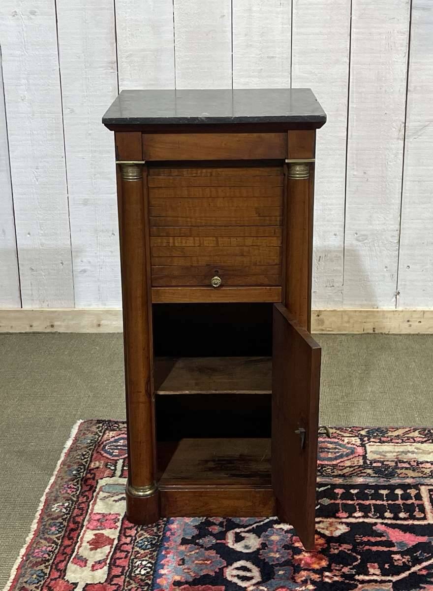 Empire bedside table from the 19th century in cherry wood and black marble.