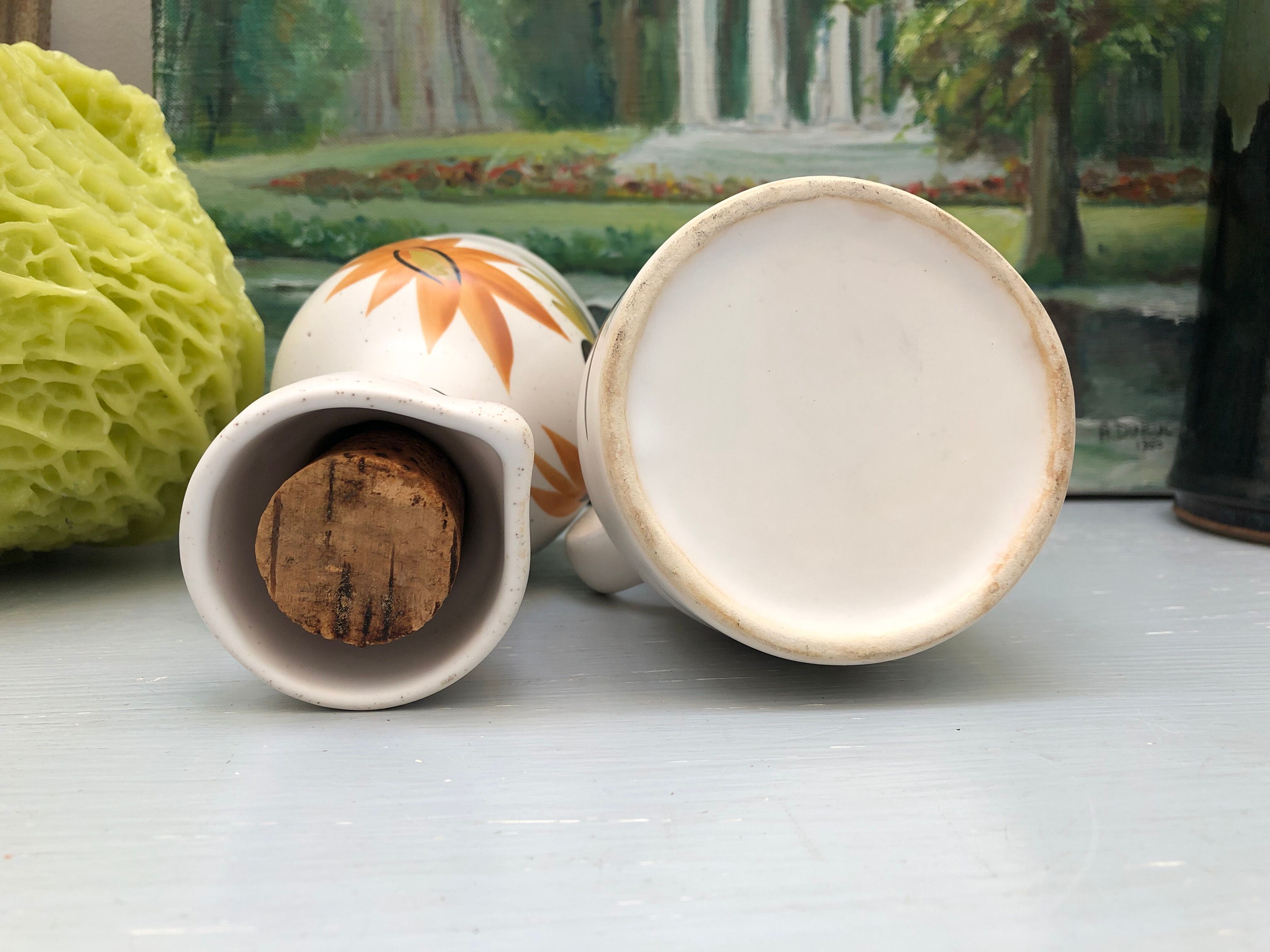 Old vinegar and oil maker with vintage decoration floral motifs