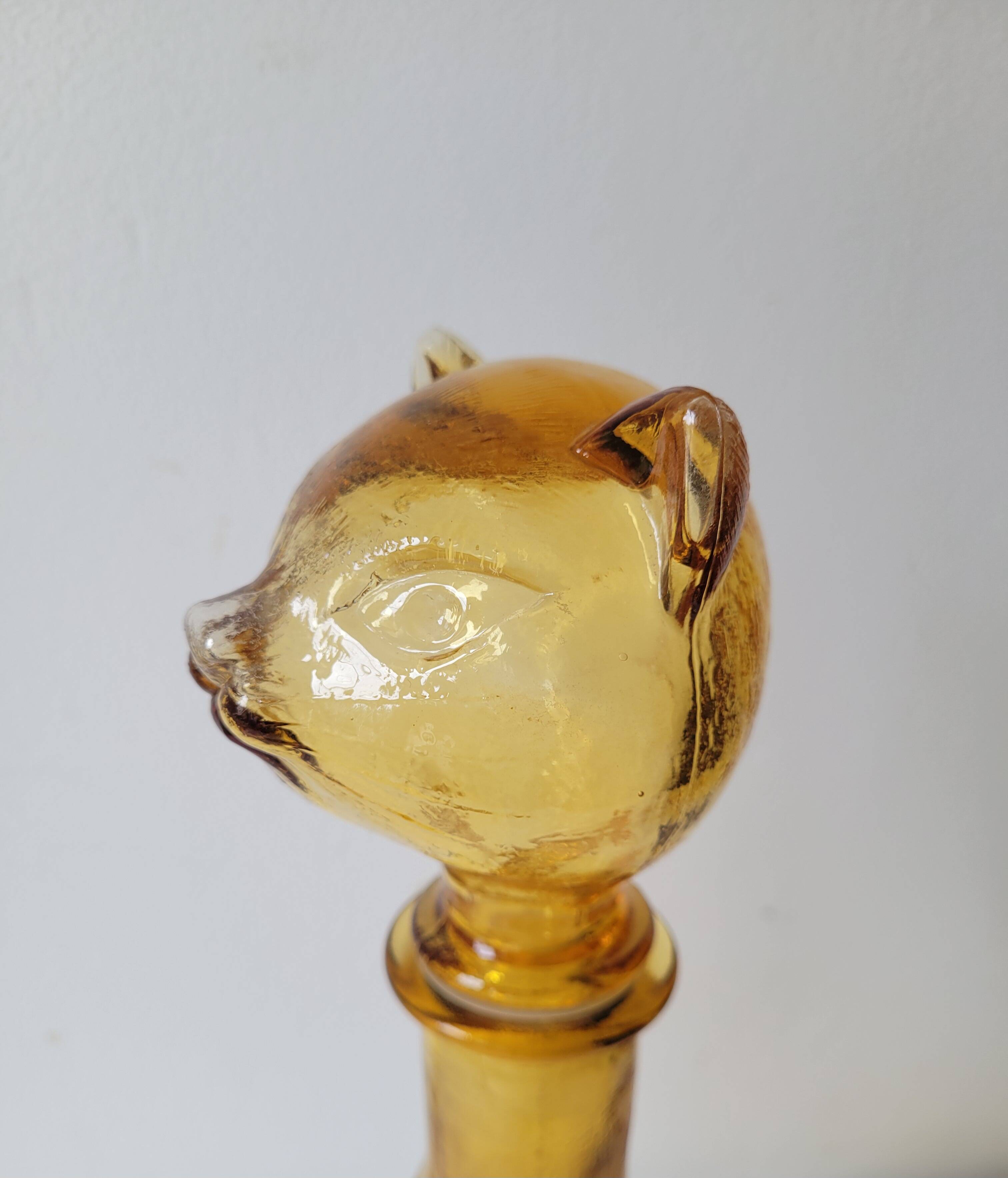 Zoomorphic carafe in amber glass