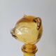 Zoomorphic carafe in amber glass