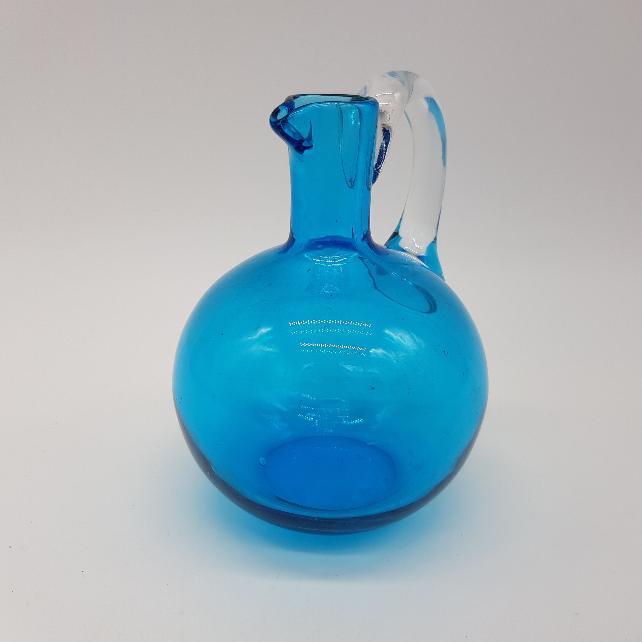 Blue blown glass pitcher