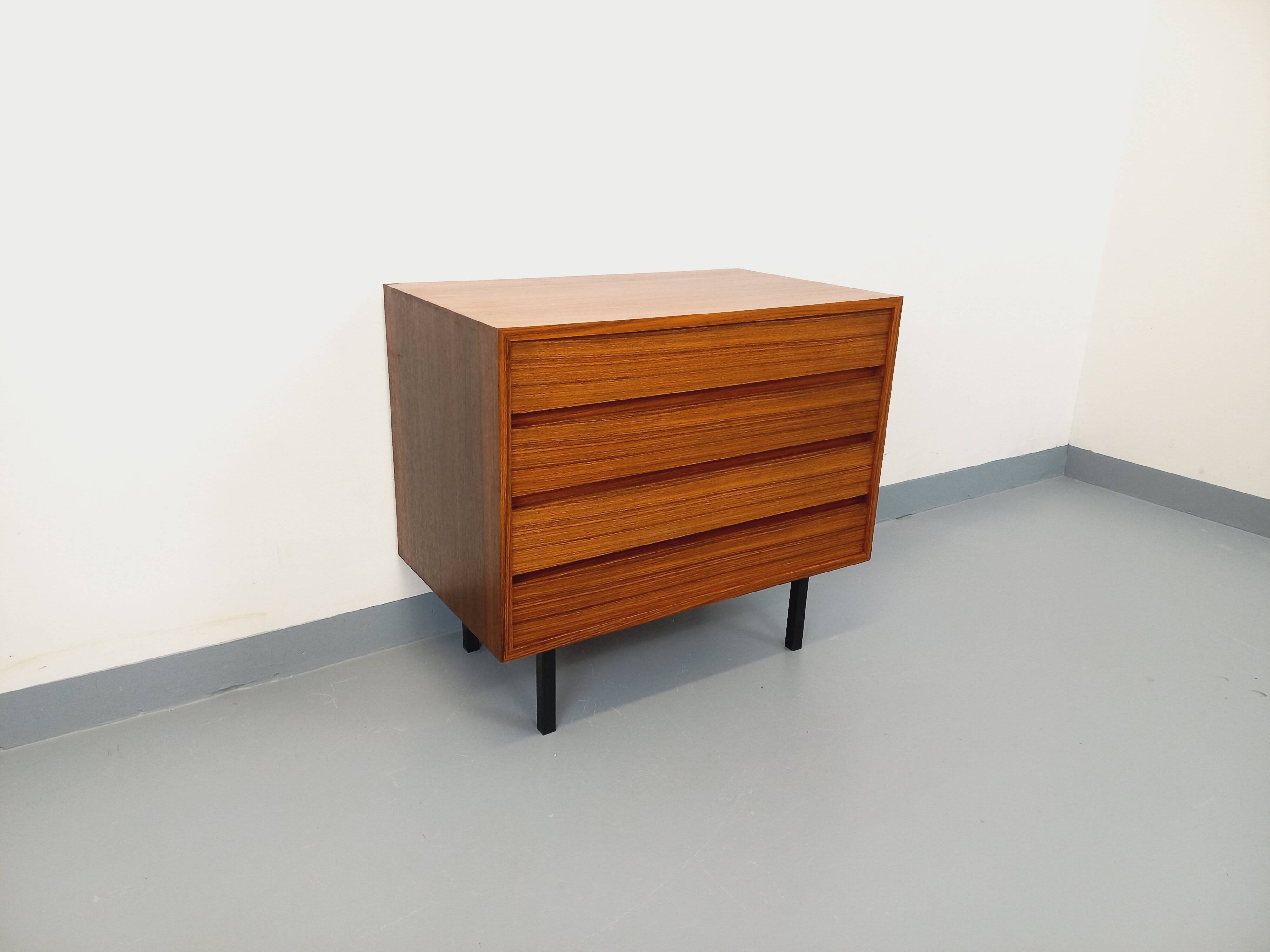 Vintage Scandinavian modernist chest of drawers in rosewood and black metal.