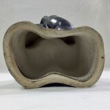 Vase with intertwined hands