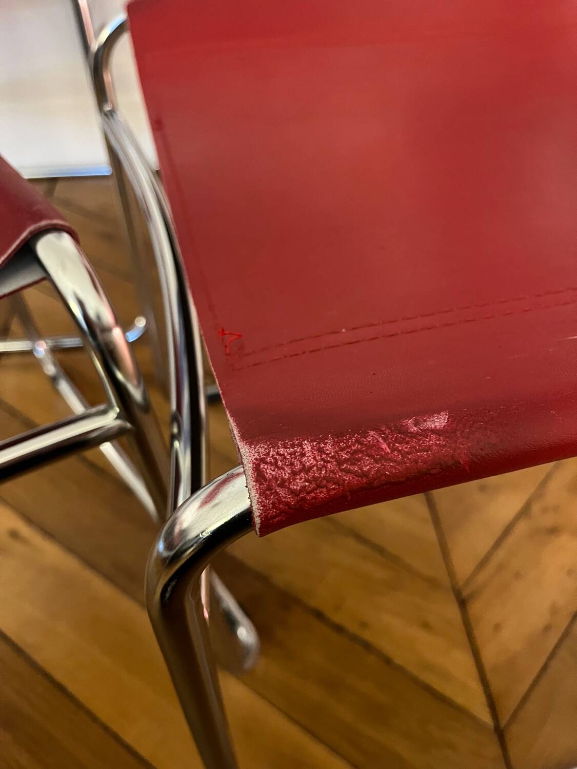 Set of 4 chairs in red leather and chrome tubular metal