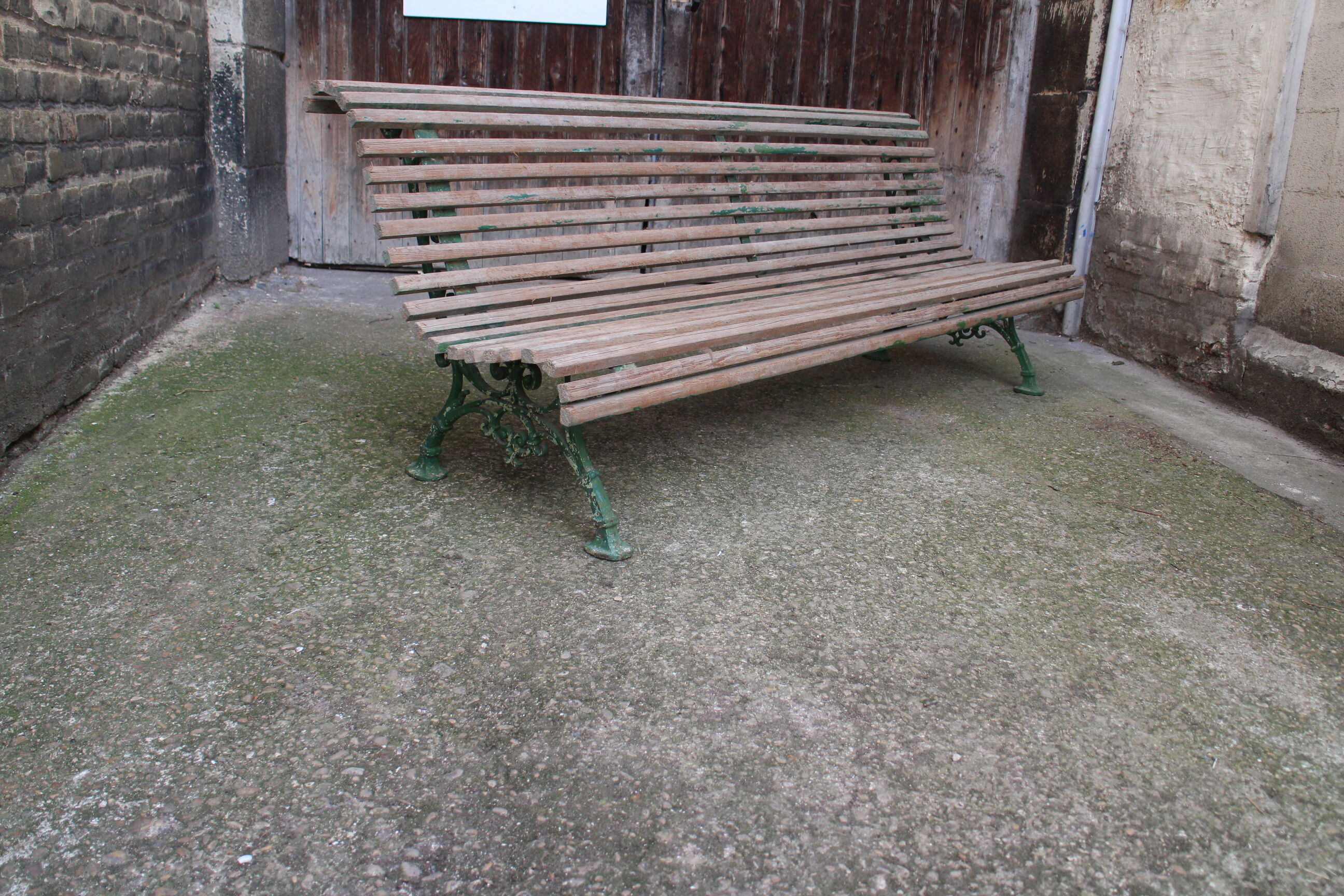 Old bench cast iron base and wooden slats