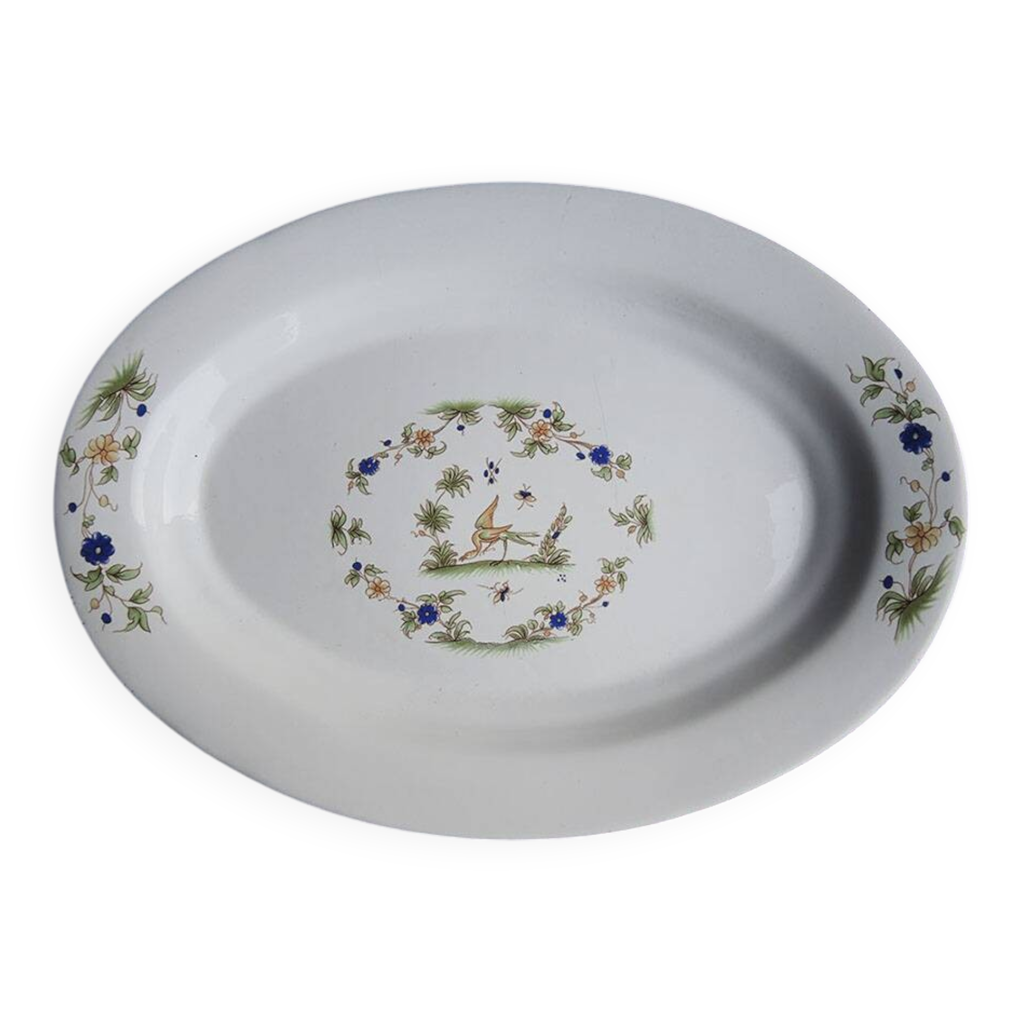 Old large oval serving dish in Moustiers earthenware.
