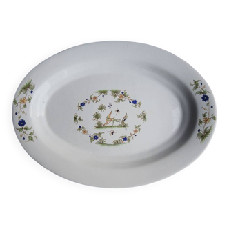 Old large oval serving dish in Moustiers earthenware.