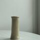 Minimalist beige ceramic vase.