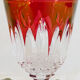 10 glasses with coloured liquor