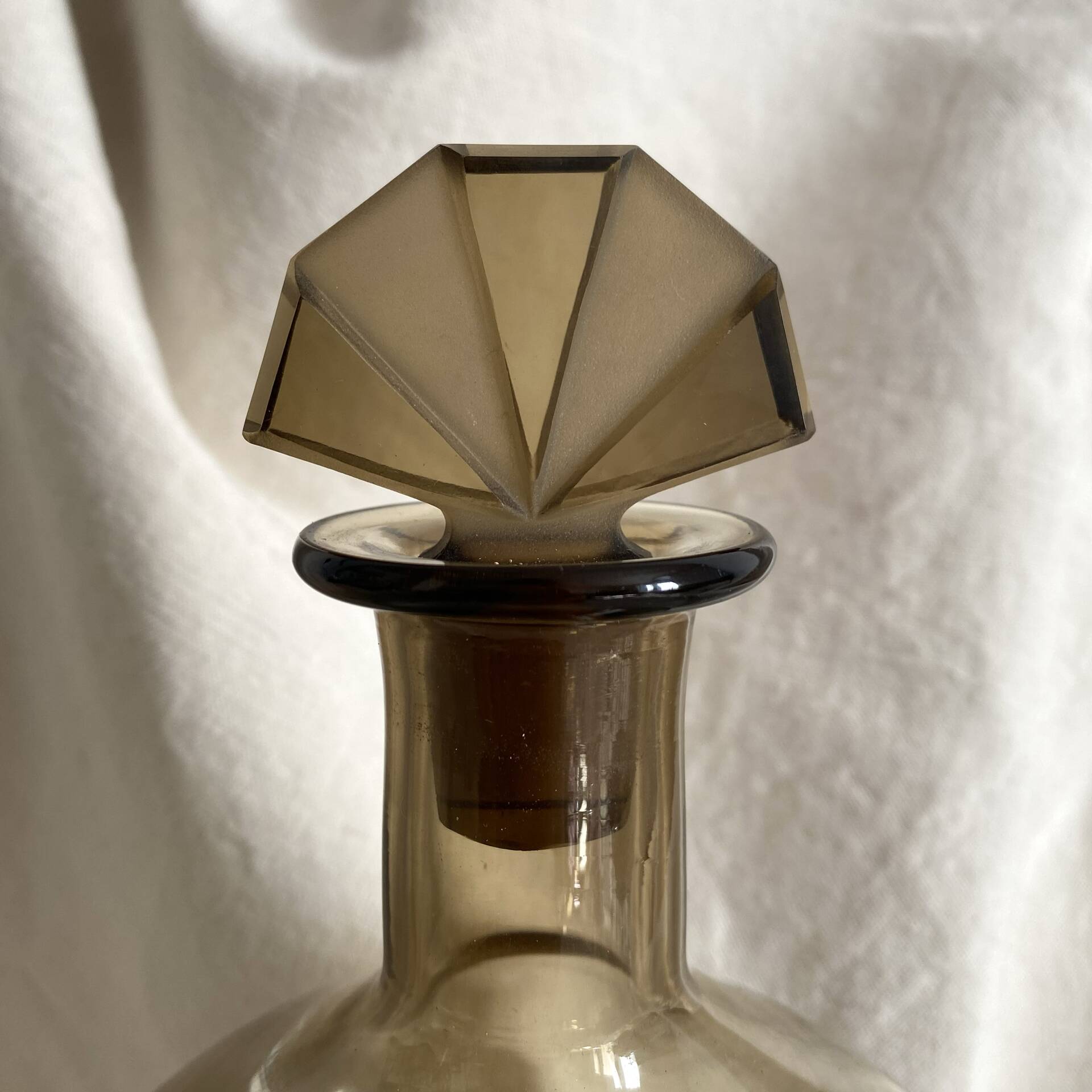 Art Deco smoked glass carafe with fan-shaped stopper.