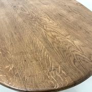 Oval table with T-shaped legs, solid oak, student woodworking project.
