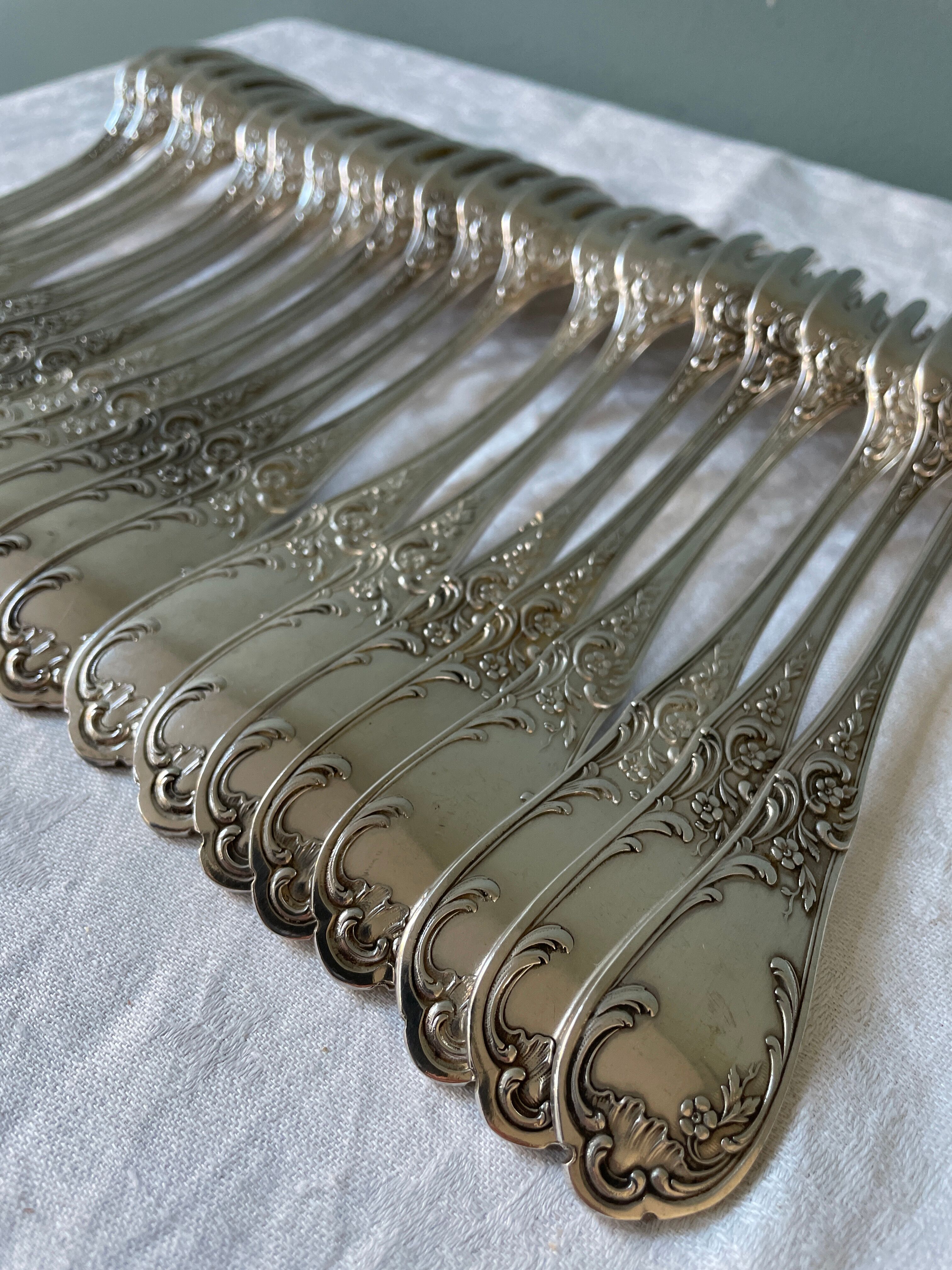 Series of 21 antique silver metal table forks