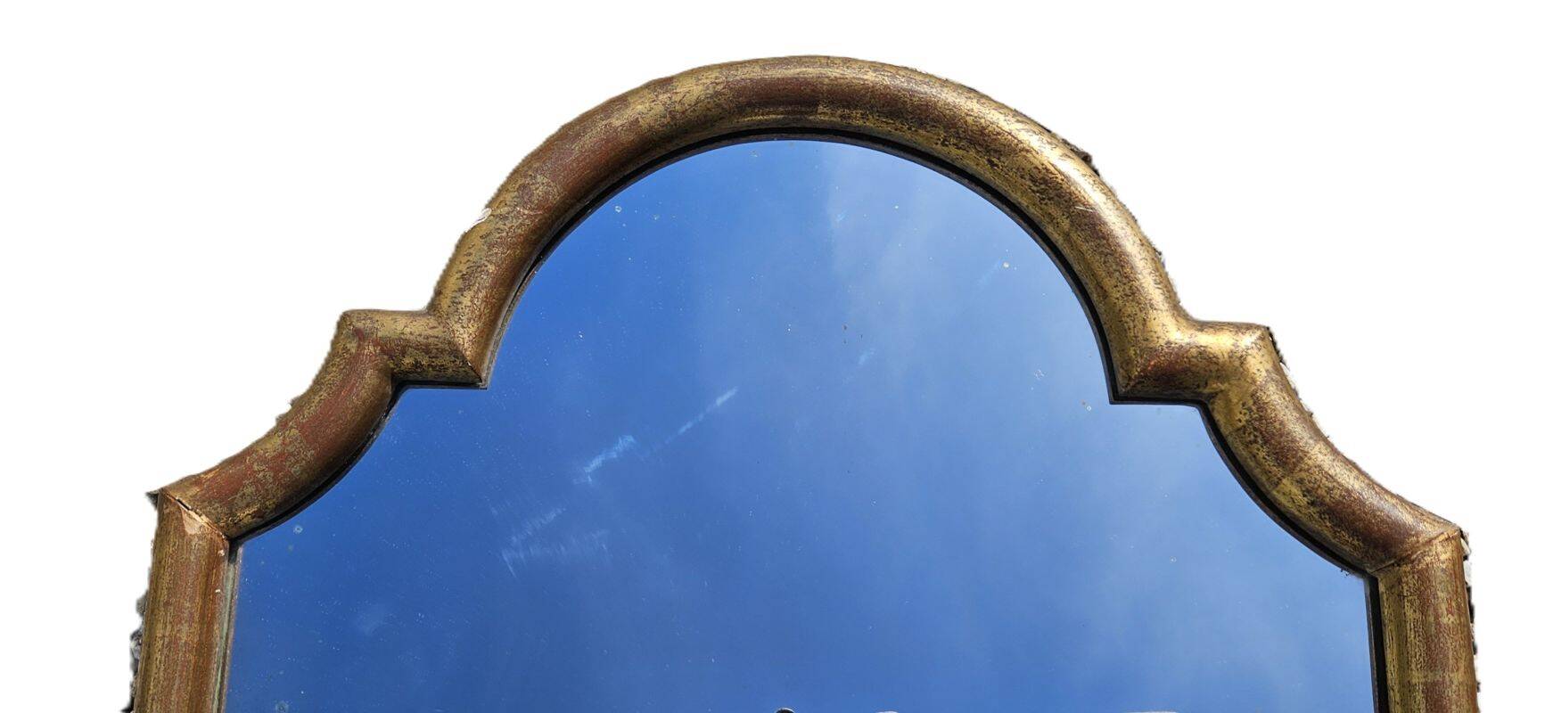 Large gilded wooden mirror in the shape of a gendarme hat