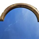 Large gilded wooden mirror in the shape of a gendarme hat