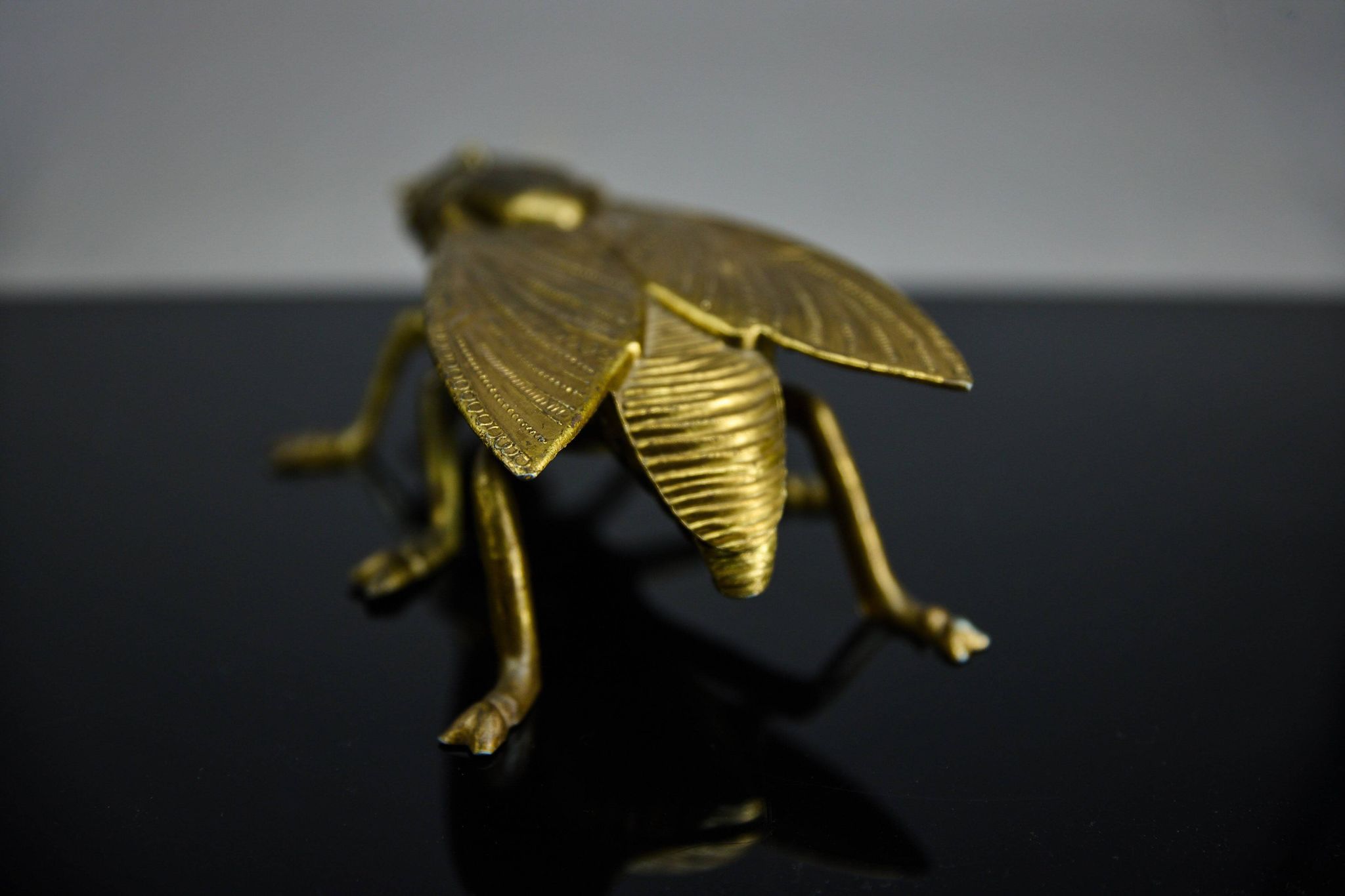 Sculptural ashtray in the shape of a giant fly in brass, Italy, circa 1950.