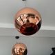Copper Tom Dixon pendant lights individually