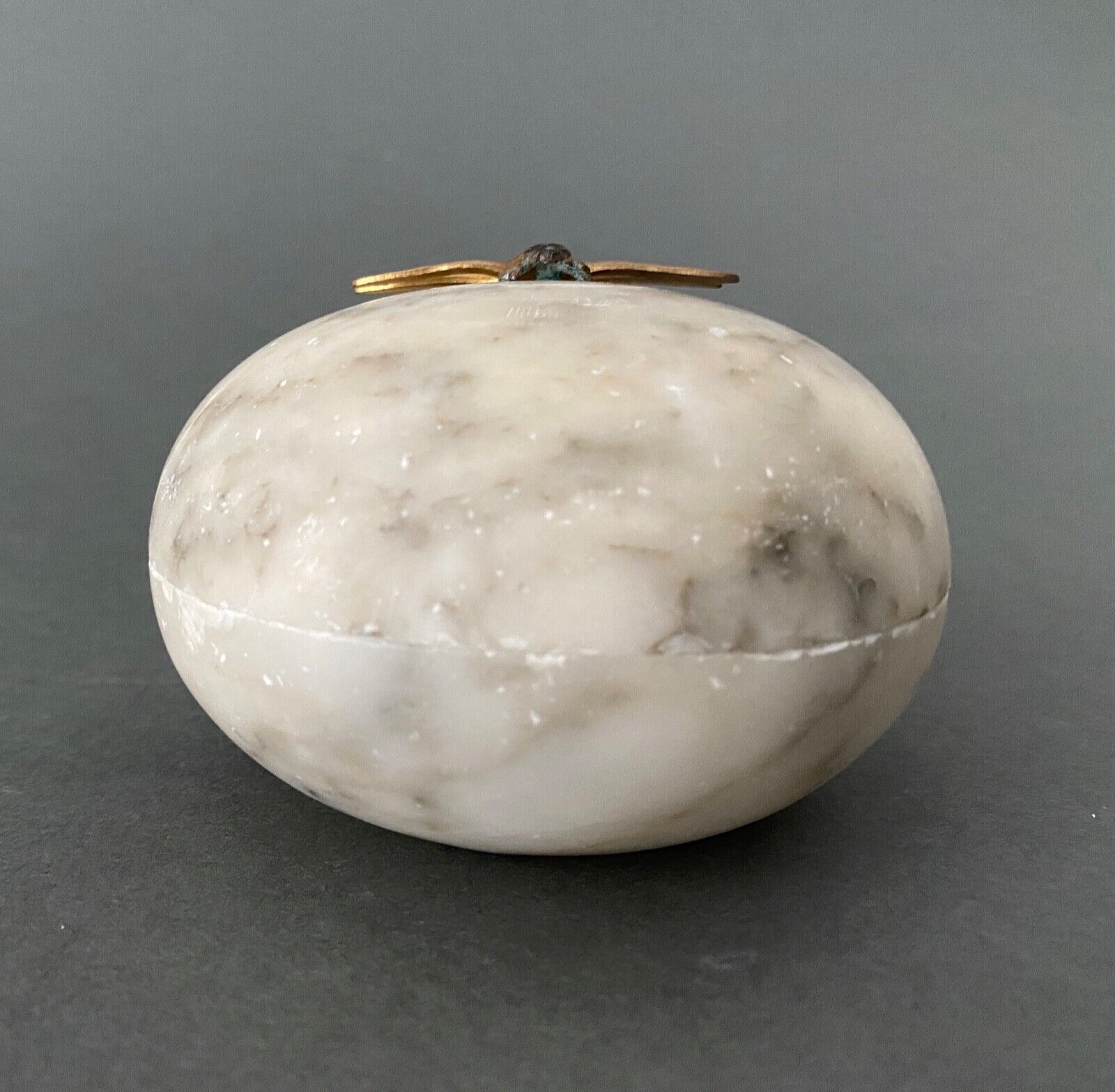 1900 alabaster ball shaped box surmounted by a golden dragonfly