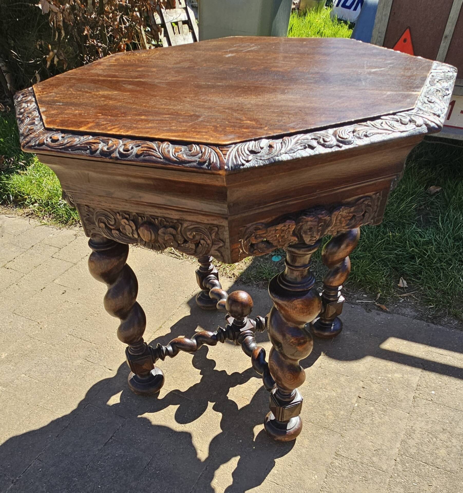 Large octagonal table in carved solid oak.