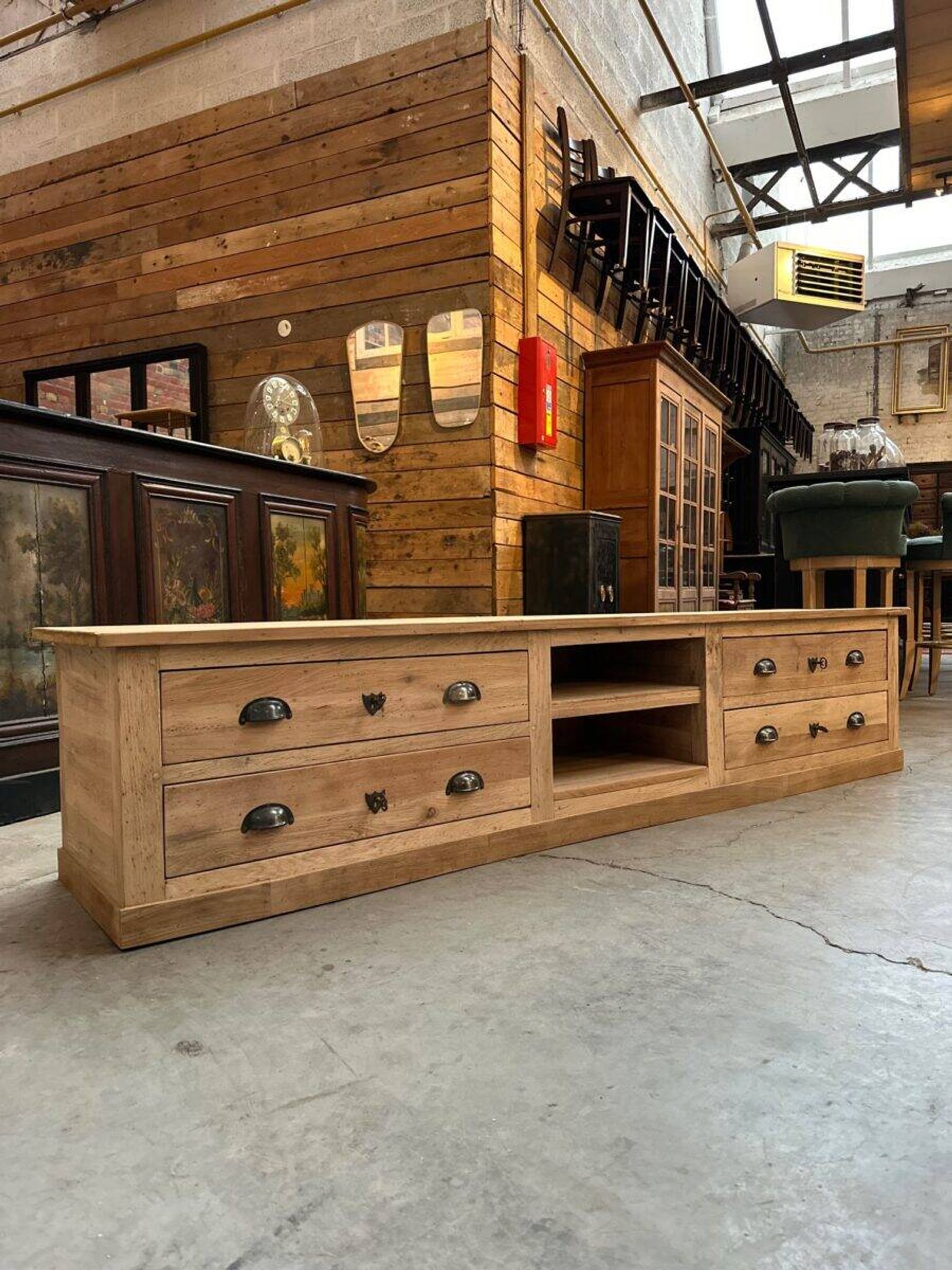 An old piece of workshop furniture transformed into a TV stand