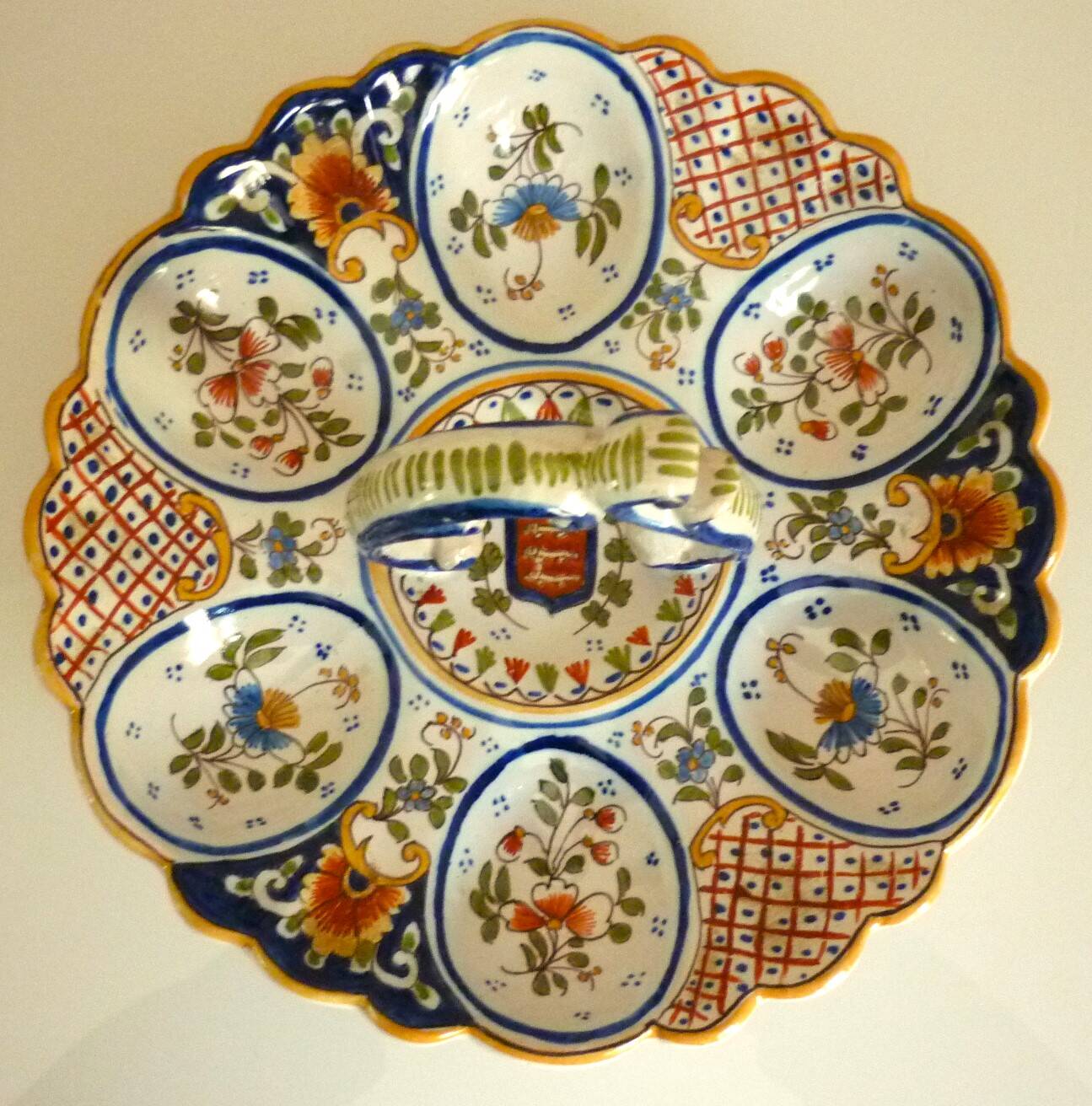 Dish, egg server in hand-painted earthenware, signed Geo Martel