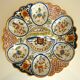 Dish, egg server in hand-painted earthenware, signed Geo Martel