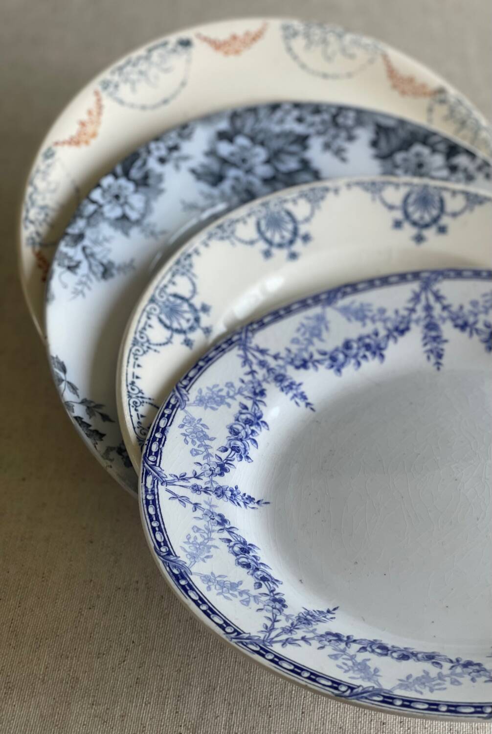 9 mismatched blue ironstone plates