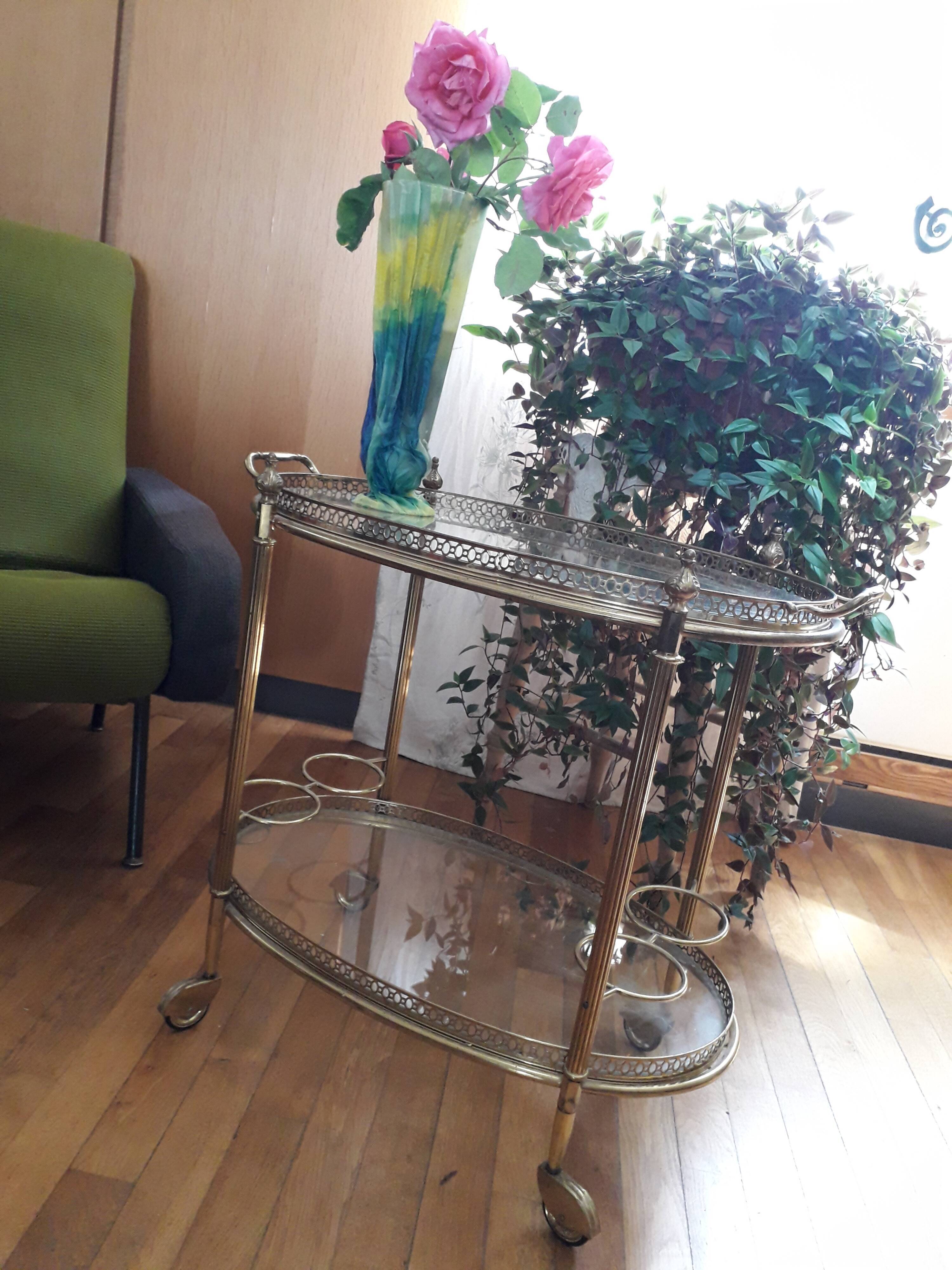 Dessert on brass wheels and glass door bottles year 60