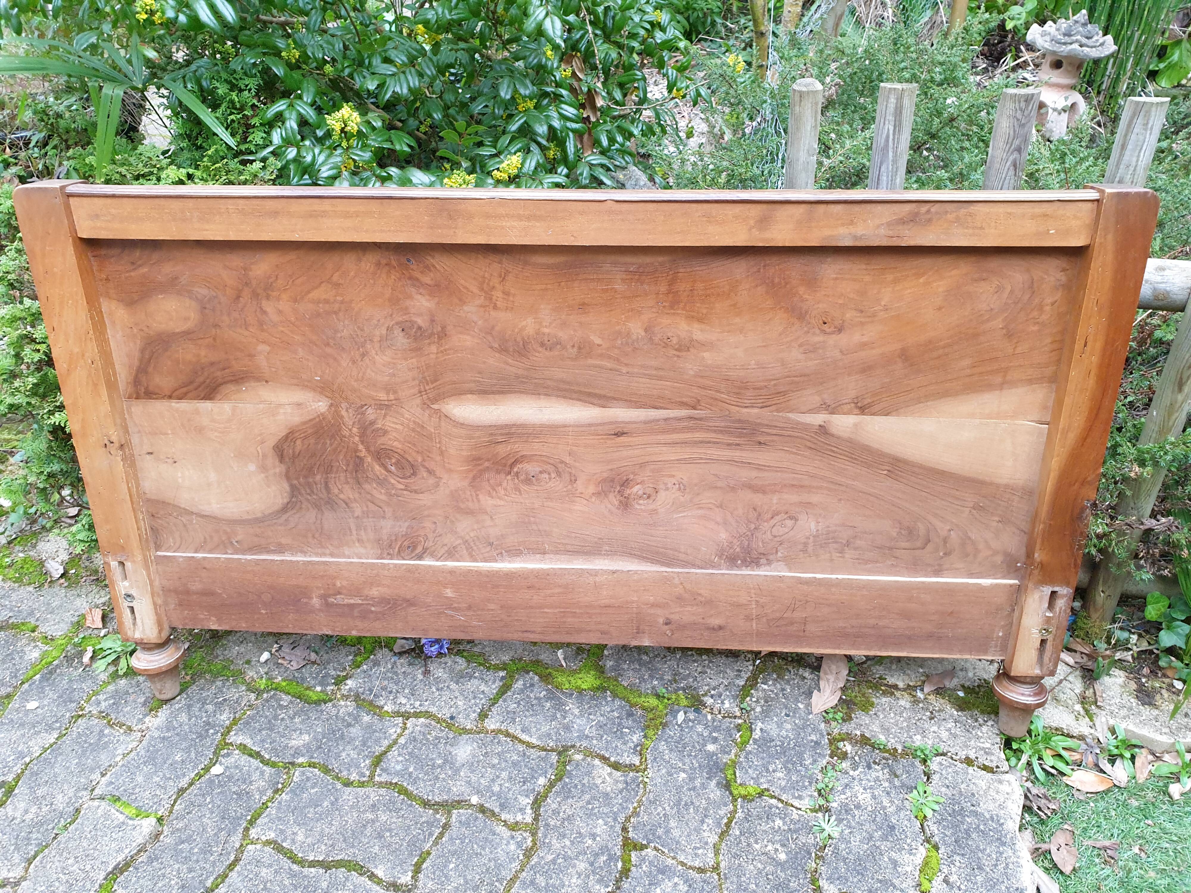 Carved walnut headboard