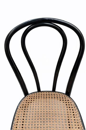 Pair of black curved wooden bistro chairs with caning in Thonet style.