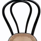 Pair of black curved wooden bistro chairs with caning in Thonet style.