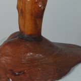 Vintage candle holder in an organic shape with a brass spike and tiered top.