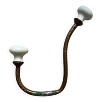 Vintage brass coat hook with ivory-style knob