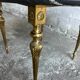 Table basse vintage en marbre noir et laiton