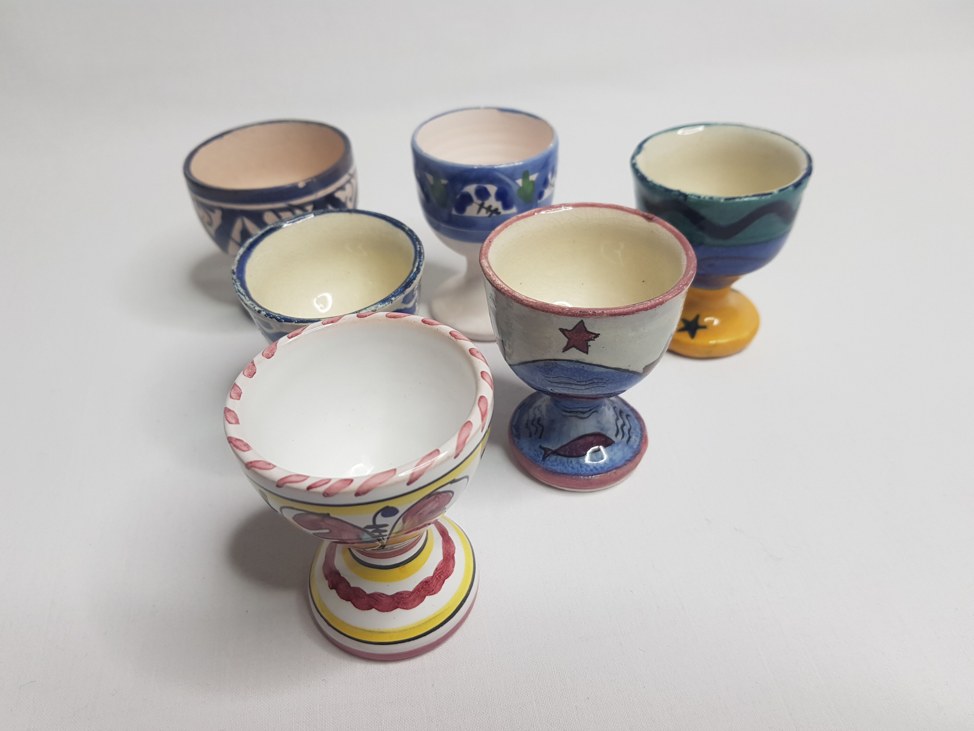 Lot of six enamelled ceramic cockroaches with Mediterranean themed decorations