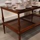 Coffee table / side table in mahogany with a rattan shelf.