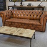 Fawn-colored tufted Chesterfield sofa