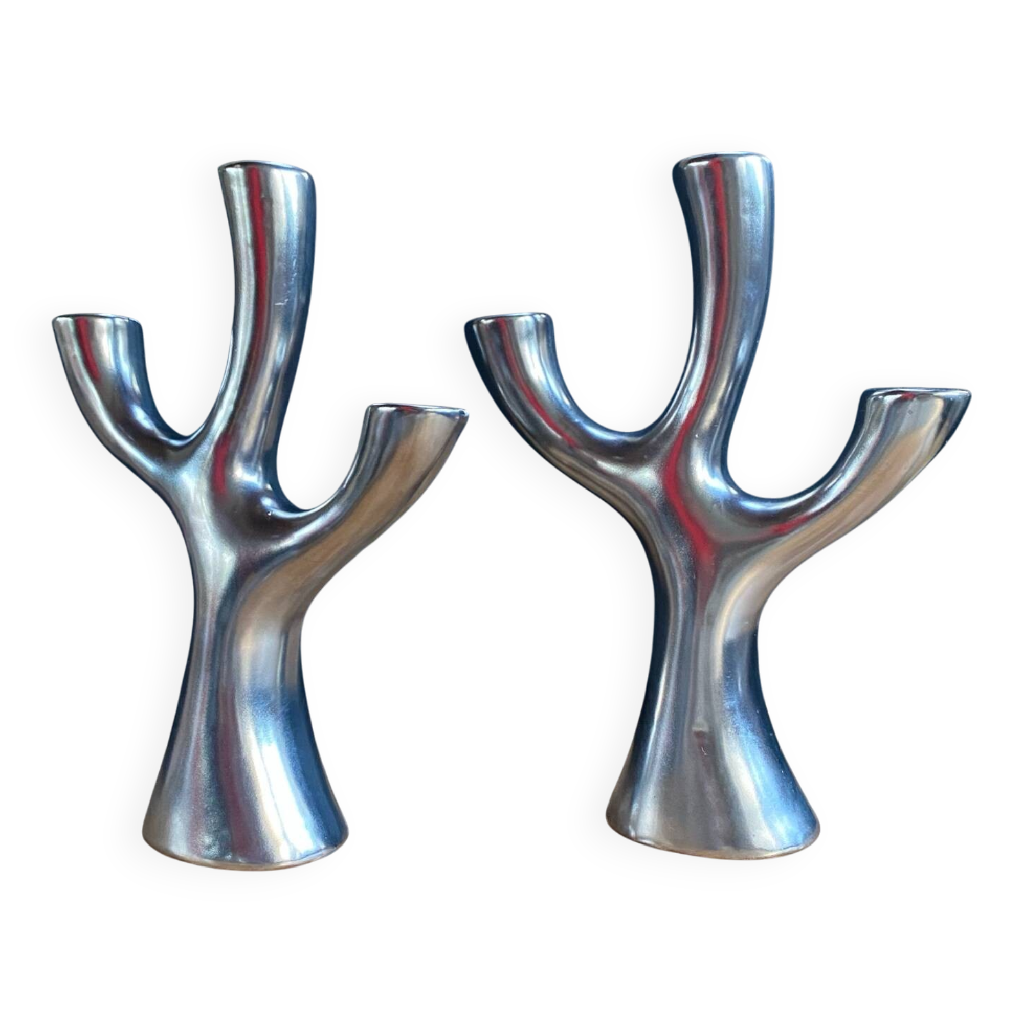 Silver candlesticks in the shape of a 3-branch tree
