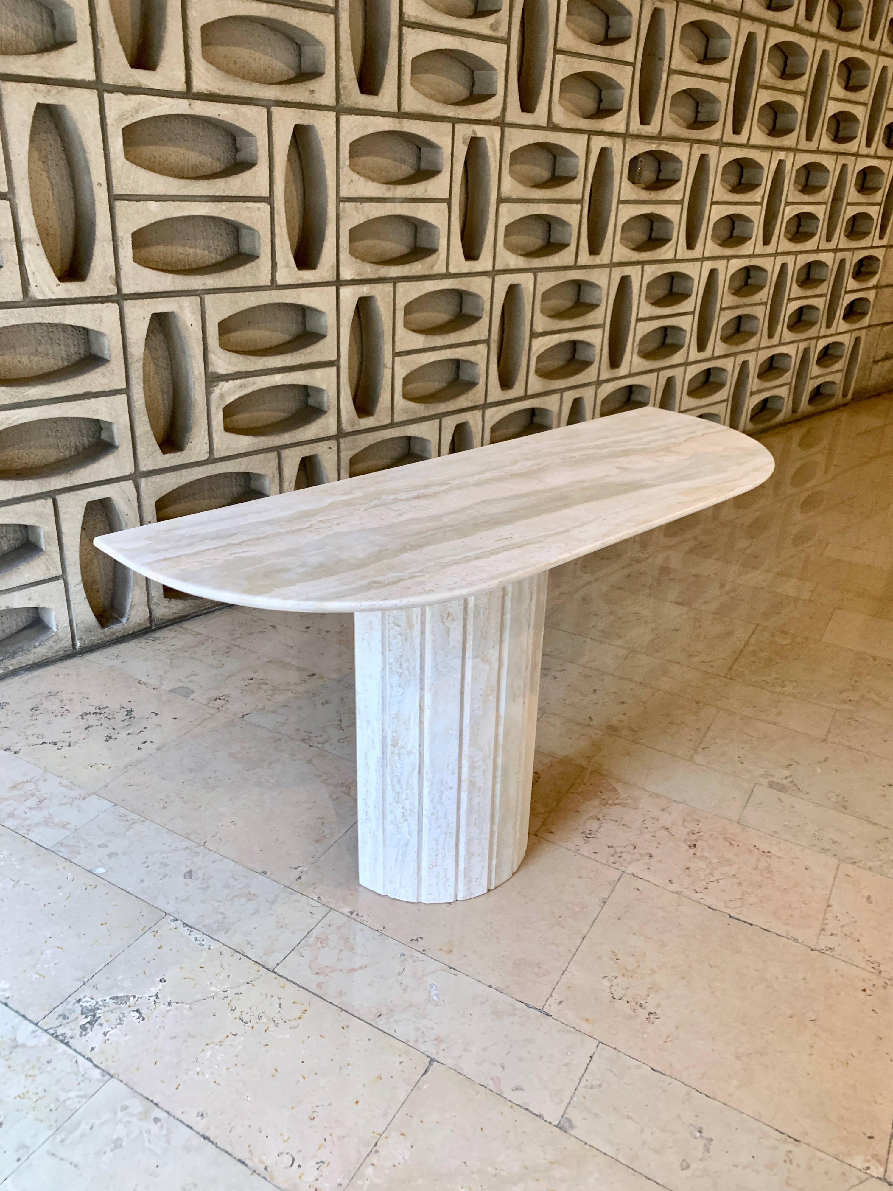 Travertine console with canted foot