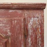Rustic Parisian cabinet in pine wood with old burgundy paint layers, ca. 18