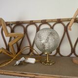 Small handcrafted globe lamp with a cracked finish and a golden brass base.