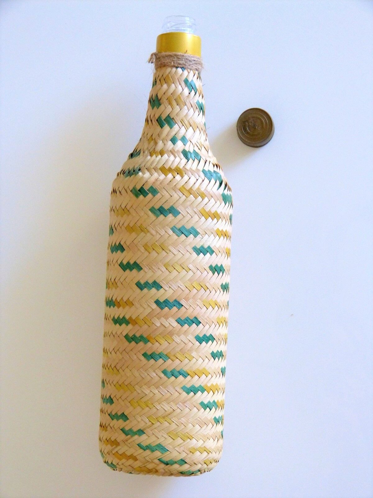 Glass and wicker bottle