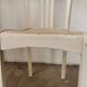 Set of 6 mismatched white chairs