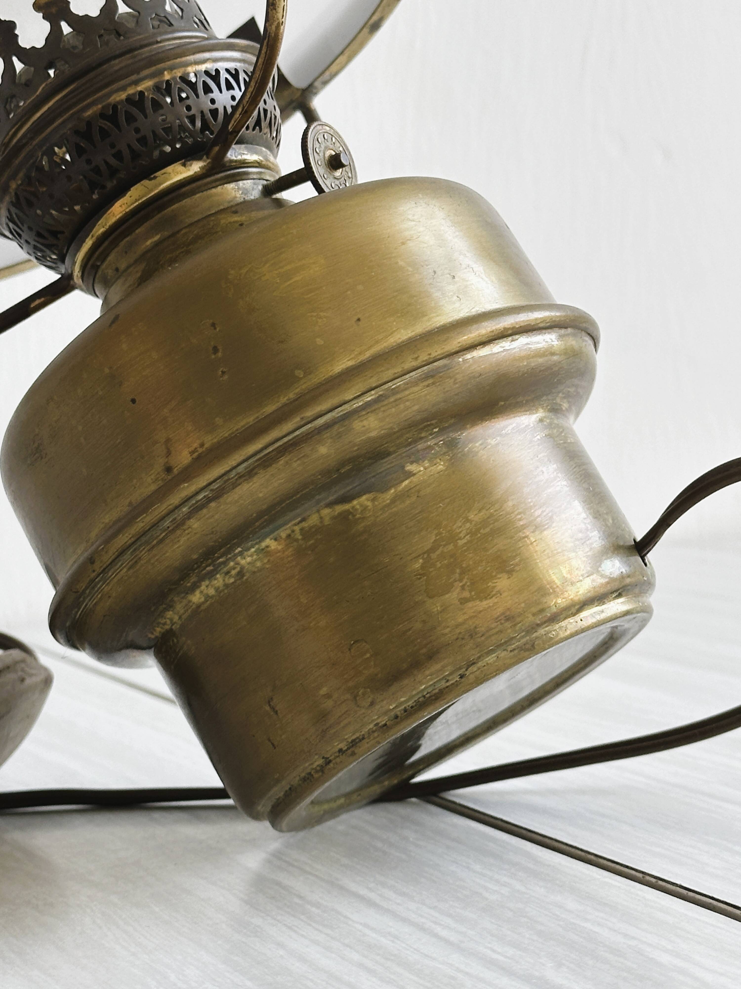 Vintage brass lamp with white opaline glass shade.