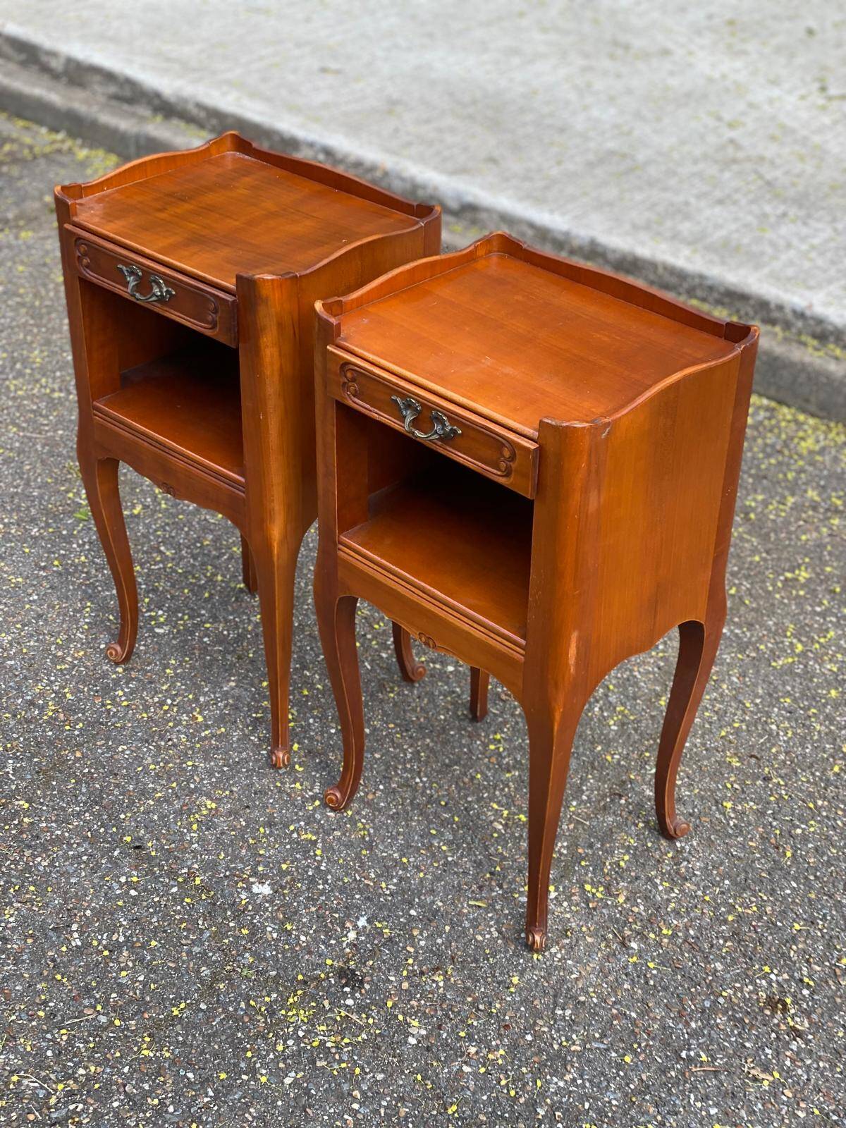 2 Louis XV bedside tables made of curved solid wood with drawers.